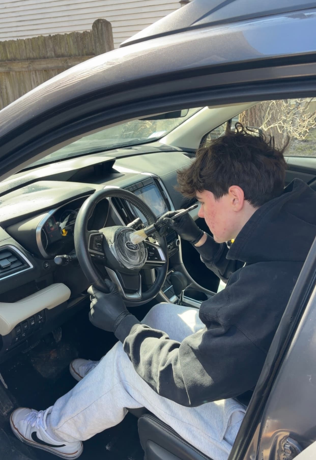 Matt detailing a car interior in Danvers, MA — steam cleaning and vacuuming